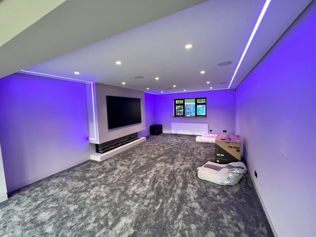 TV room with colour change plaster in LED's & Front hidden speakers & Rear in-wall speakers - Farnham, Essex